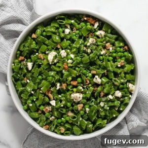 Triple Pea Delight 6 Close-up of the Three Pea Salad in a stylish serving bowl, highlighting the fresh peas, feta, and herbs.