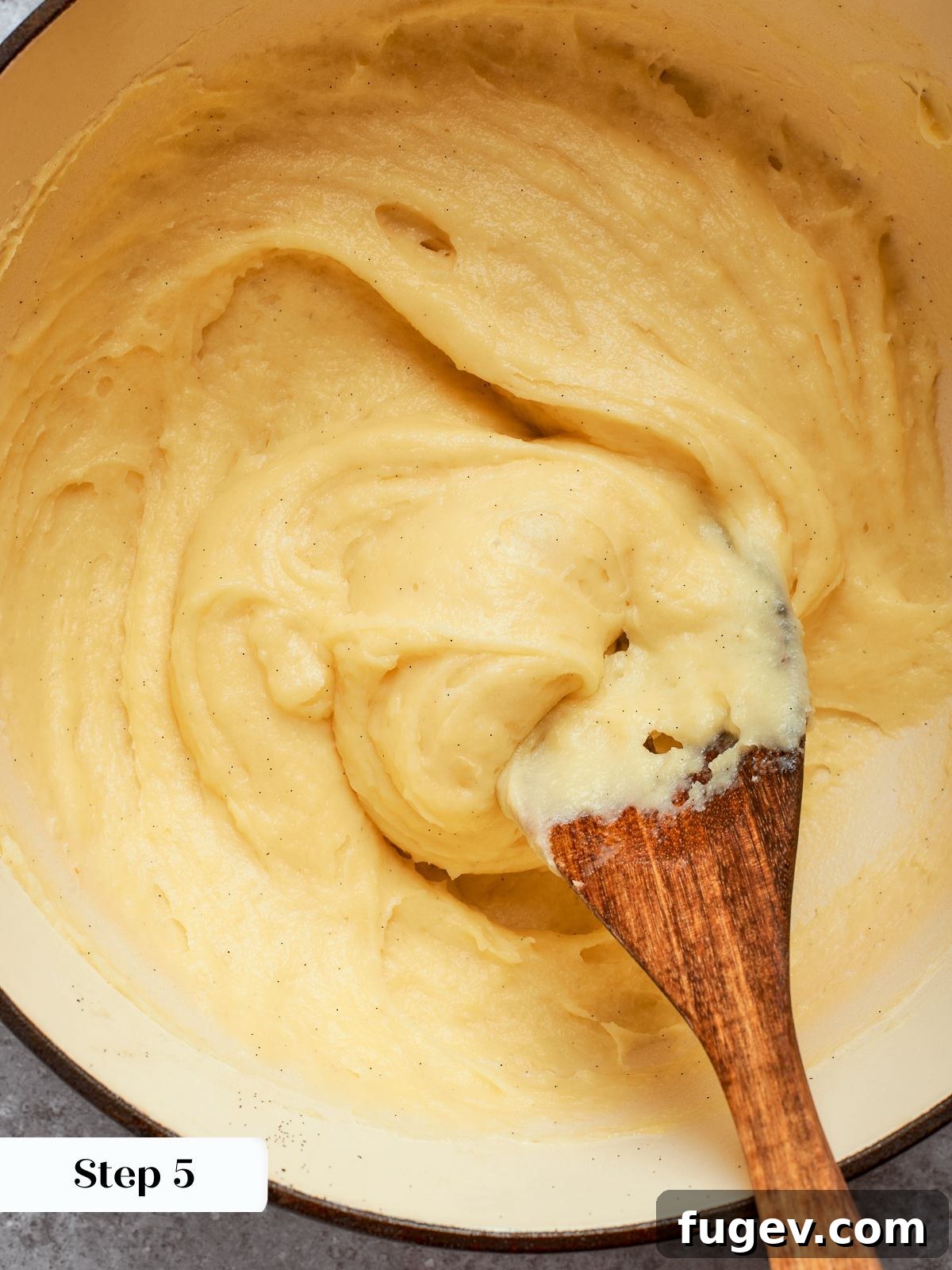 Sweet Cream Clouds 12 Thickened pastry cream in pot after cooking, smooth and glossy from constant whisking, ready for cooling.