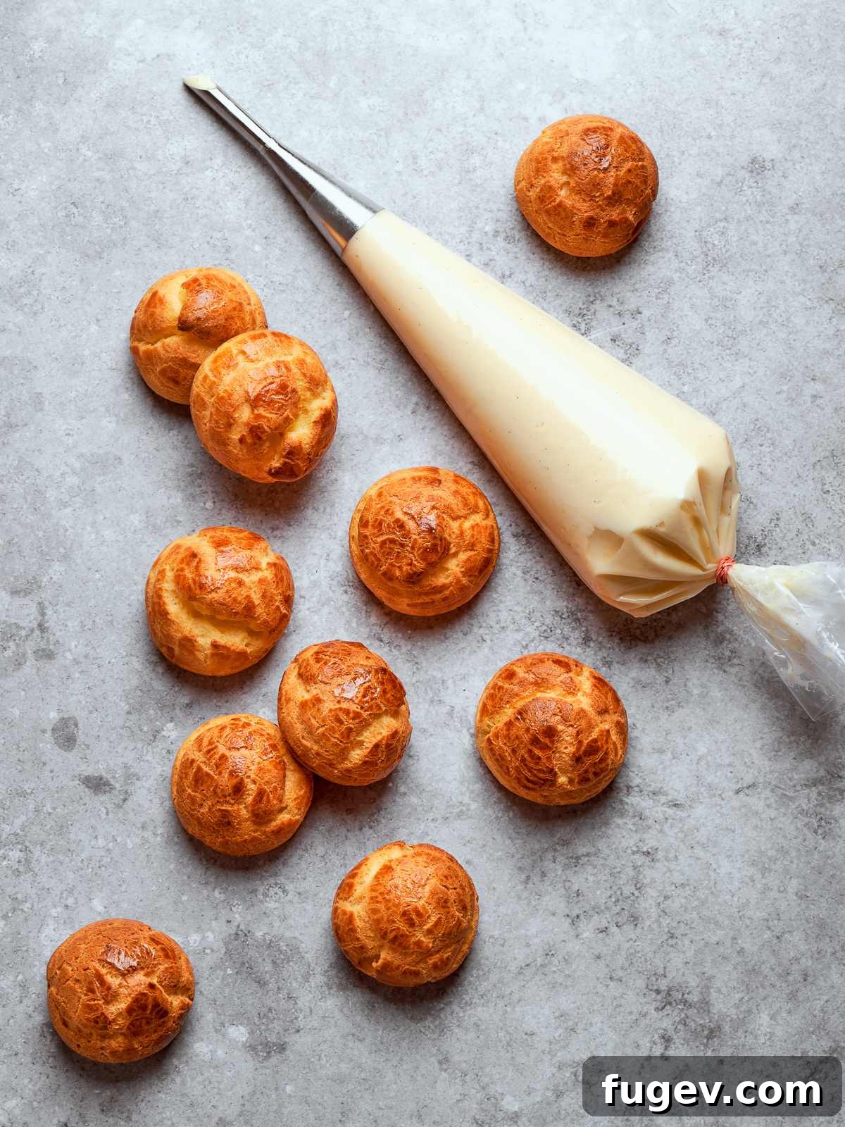 Sweet Cream Clouds 32 Piping bag filled with smooth crème légère ready for filling pastries or desserts, highlighting its creamy consistency.