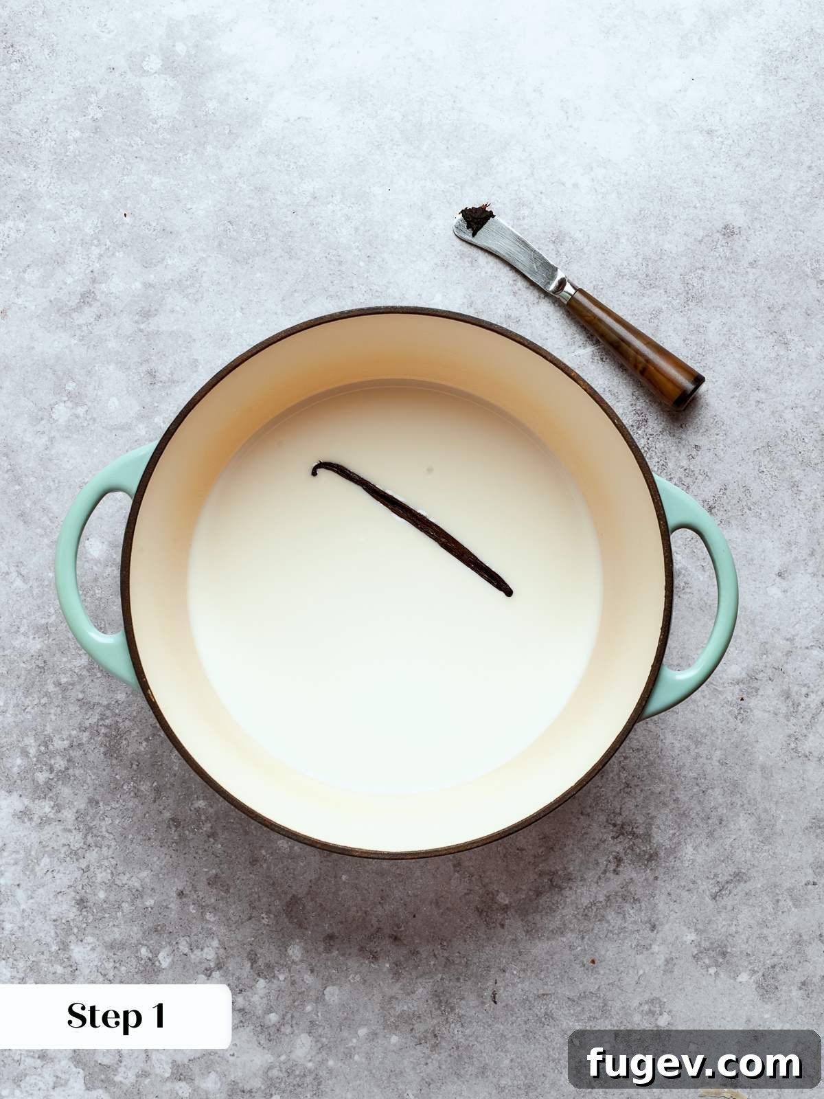 Sweet Cream Clouds 7 Milk and vanilla heating in a pot until steaming, releasing aromatic flavors for tempering eggs.