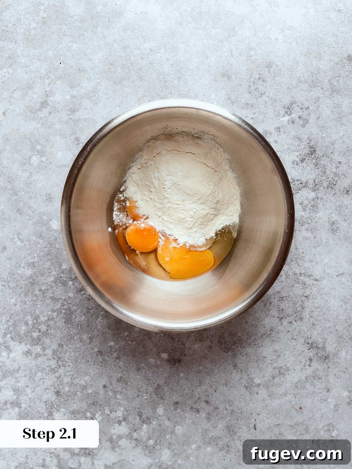 Sweet Cream Clouds 8 Eggs and sugar being whisked together in a bowl to form the pastry cream base, showing its pale yellow hue.