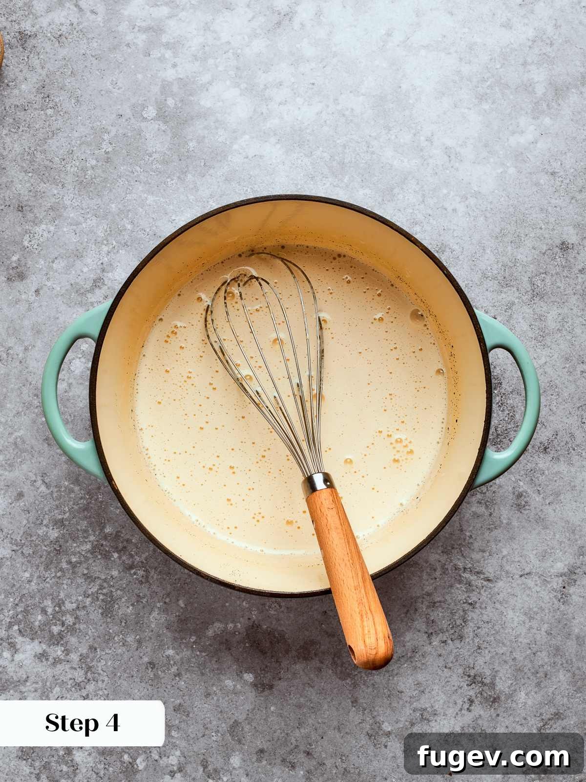 Combined ingredients before cooking, showing liquid mixture of milk, eggs, and sugar.