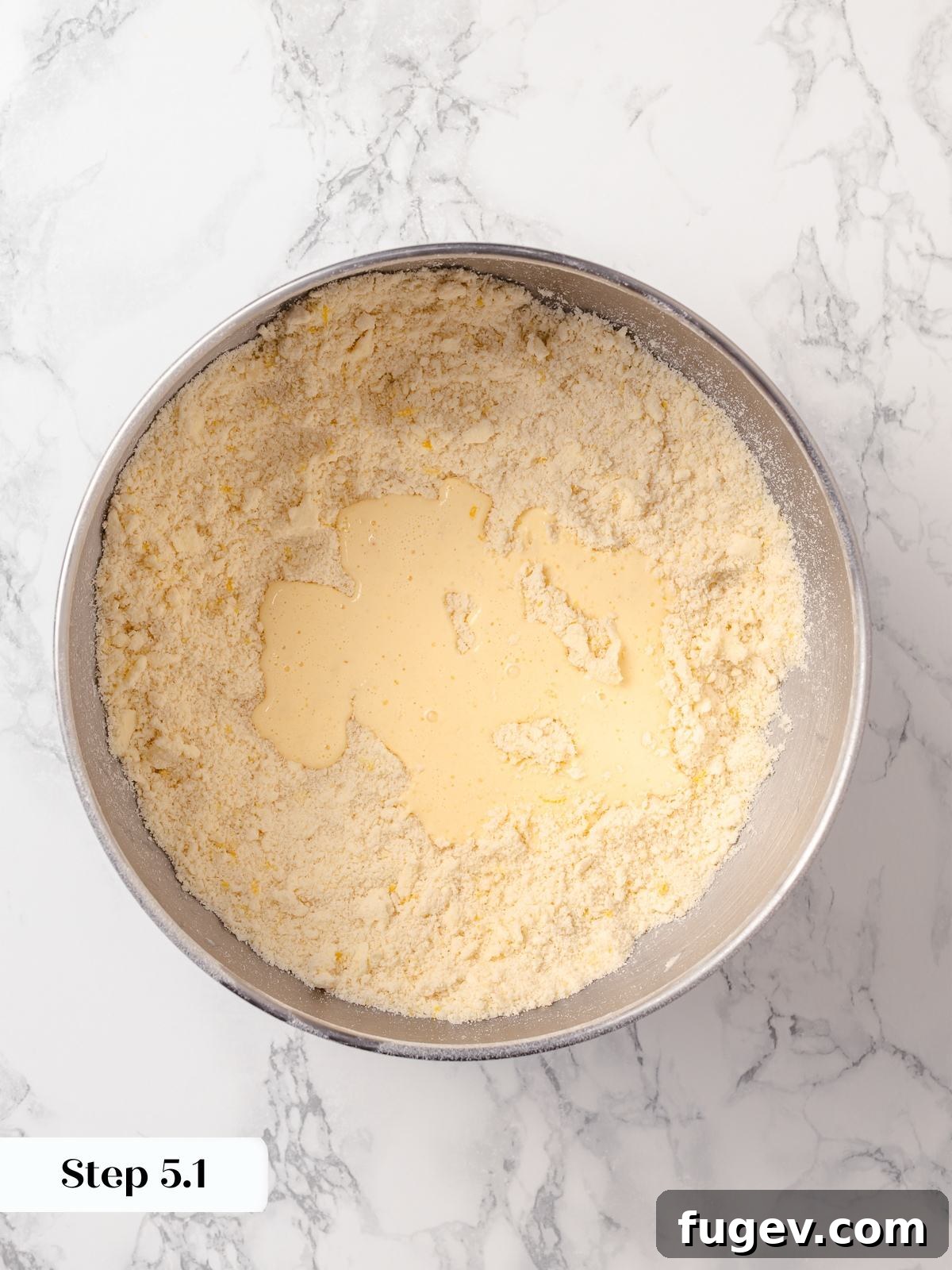 Sun-Kissed Lemon Scones 11 Wet ingredients gently mixed into dry ingredients, just until combined, forming a soft scone dough without overworking it.