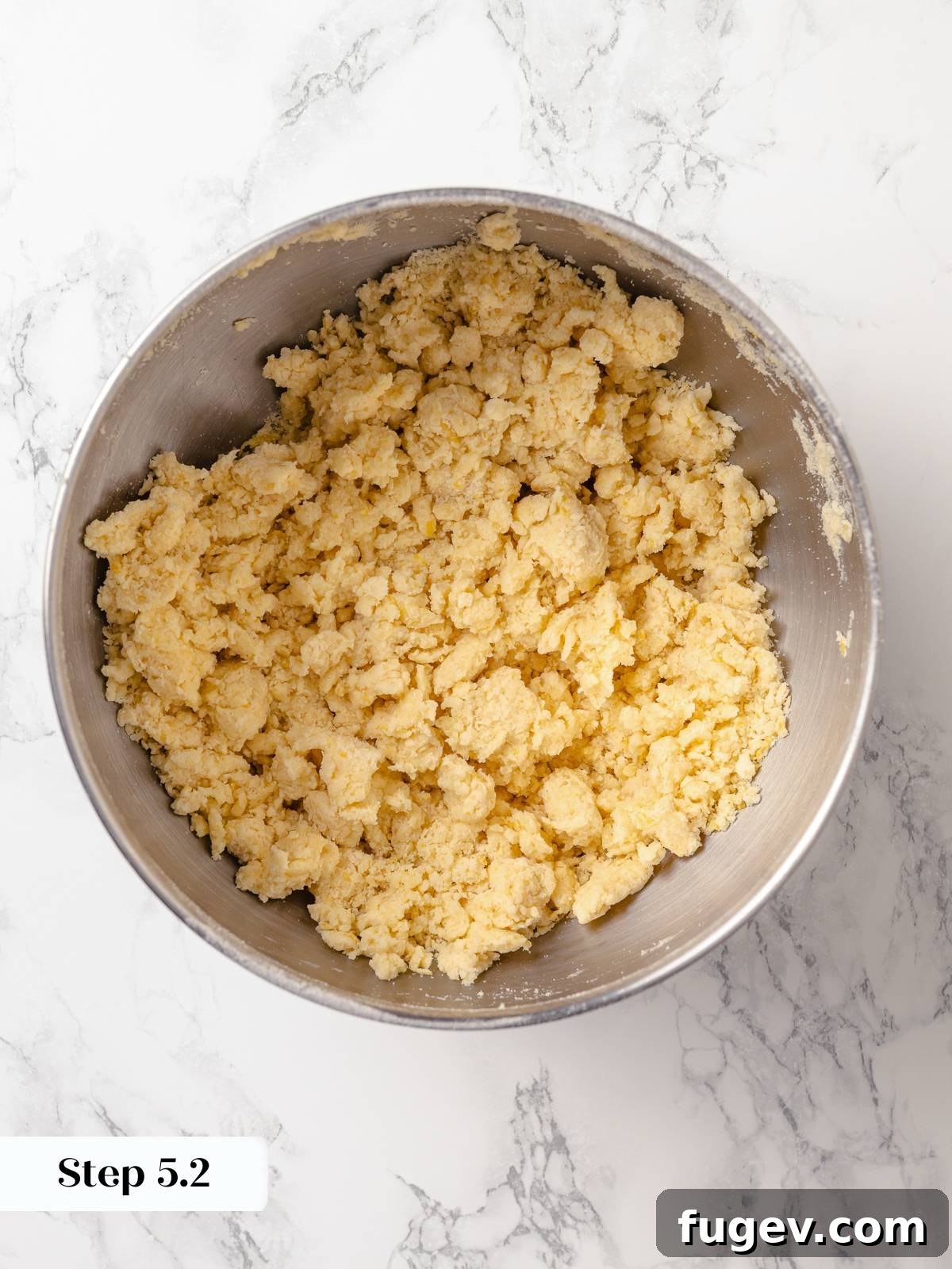 Sun-Kissed Lemon Scones 12 Scone dough freshly combined with no visible dry flour, exhibiting a shaggy texture, ready to be shaped and chilled.