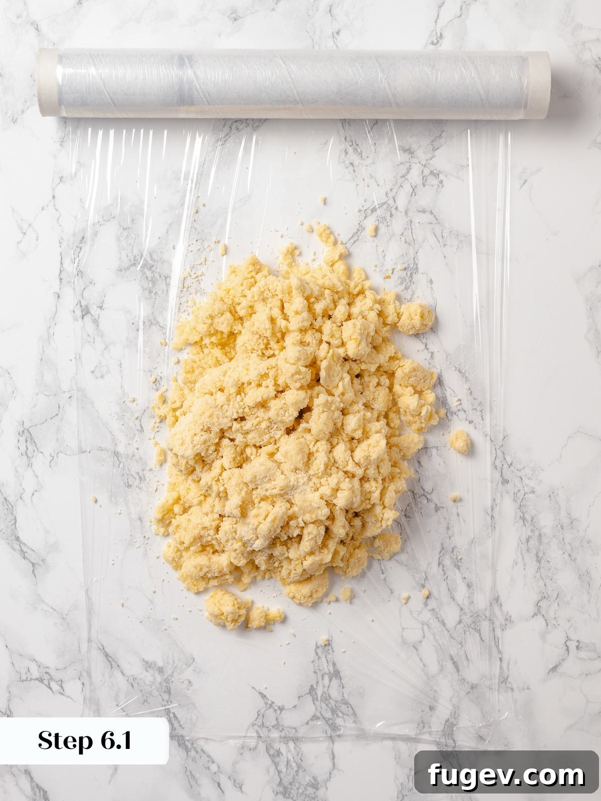 Sun-Kissed Lemon Scones 13 Loose dough gently pressed together to form a uniform dough, preparing it for shaping and its essential chilling period.