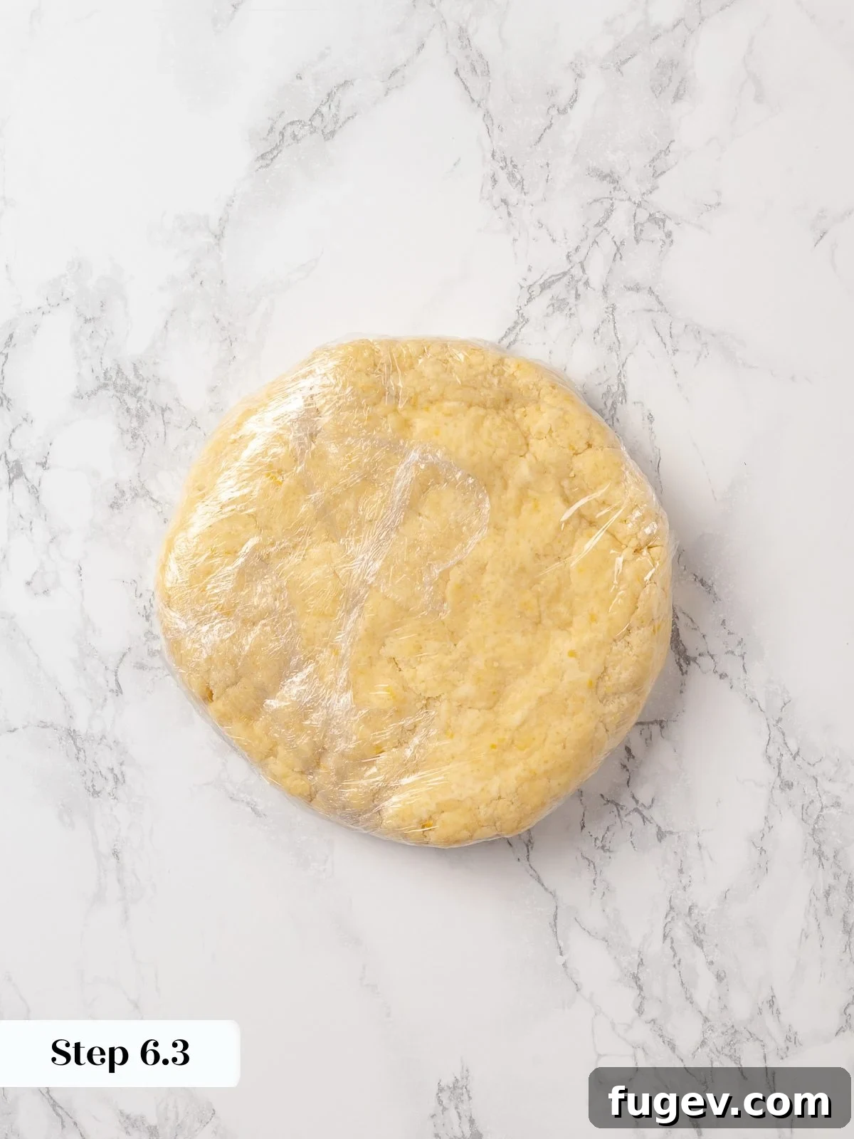 Sun-Kissed Lemon Scones 15 Chilled scone dough resting on a surface after refrigeration, perfectly firmed and ready for rolling and shaping into triangles.