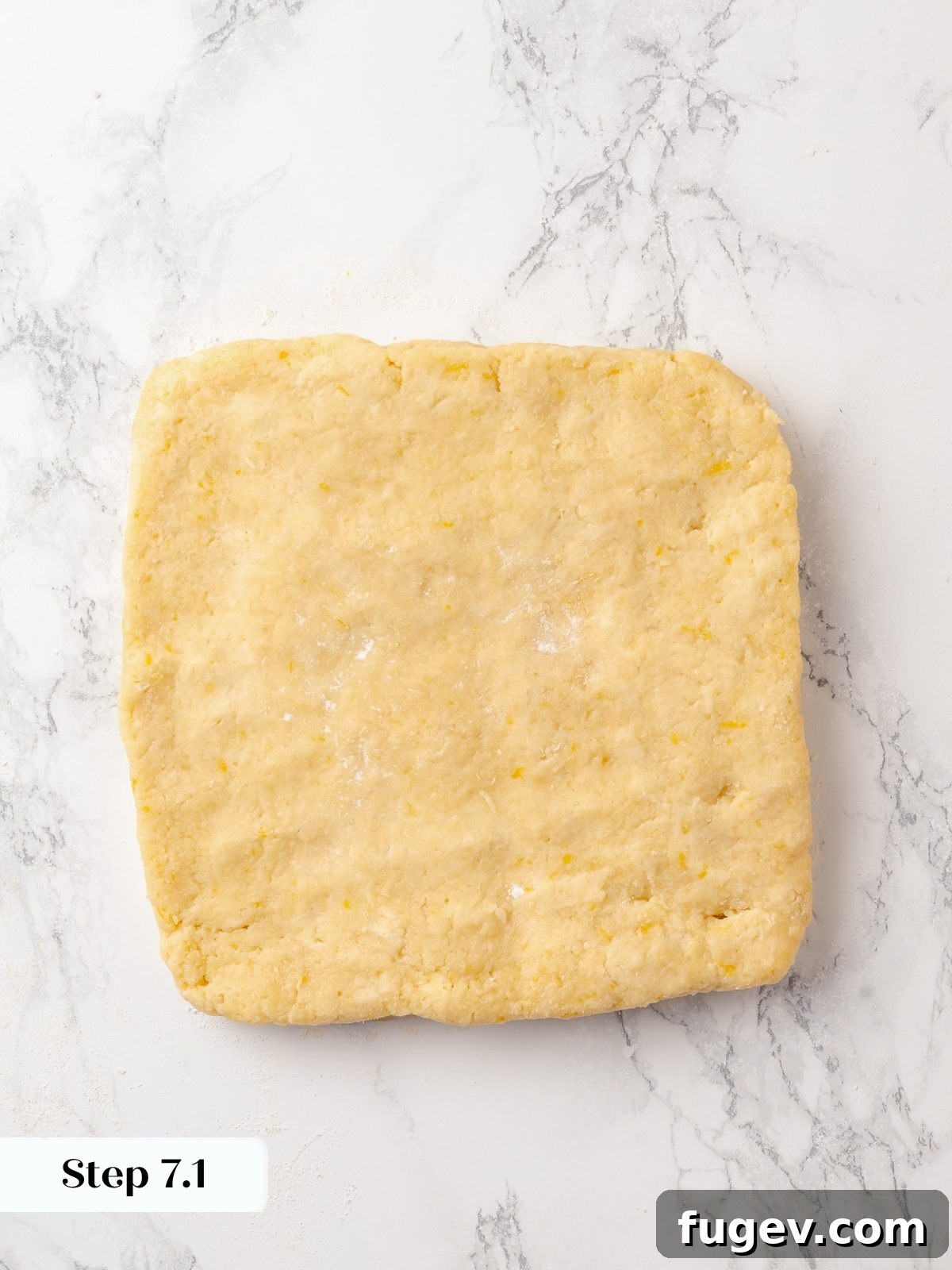 Sun-Kissed Lemon Scones 16 Scone dough rolled to an even ½-inch thickness, perfectly preparing it for cutting into uniform triangles.