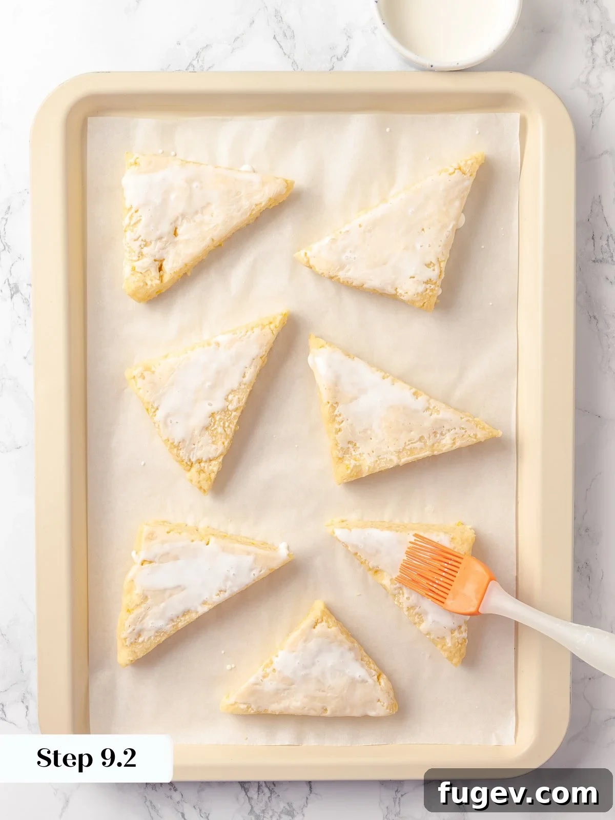 Sun-Kissed Lemon Scones 18 Shaped scone dough, uniformly brushed with heavy cream before baking, a key step to create a beautiful golden and crisp exterior.