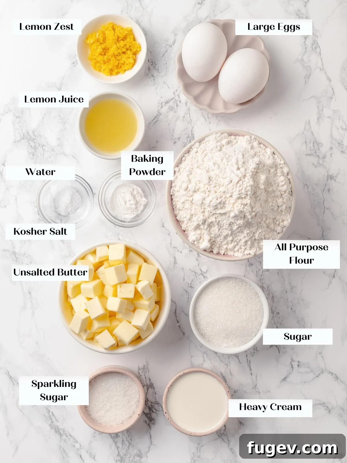 Sun-Kissed Lemon Scones 4 Ingredients for lemon scones arranged on a clean countertop, including flour, butter, eggs, and fresh lemons, ready for baking.