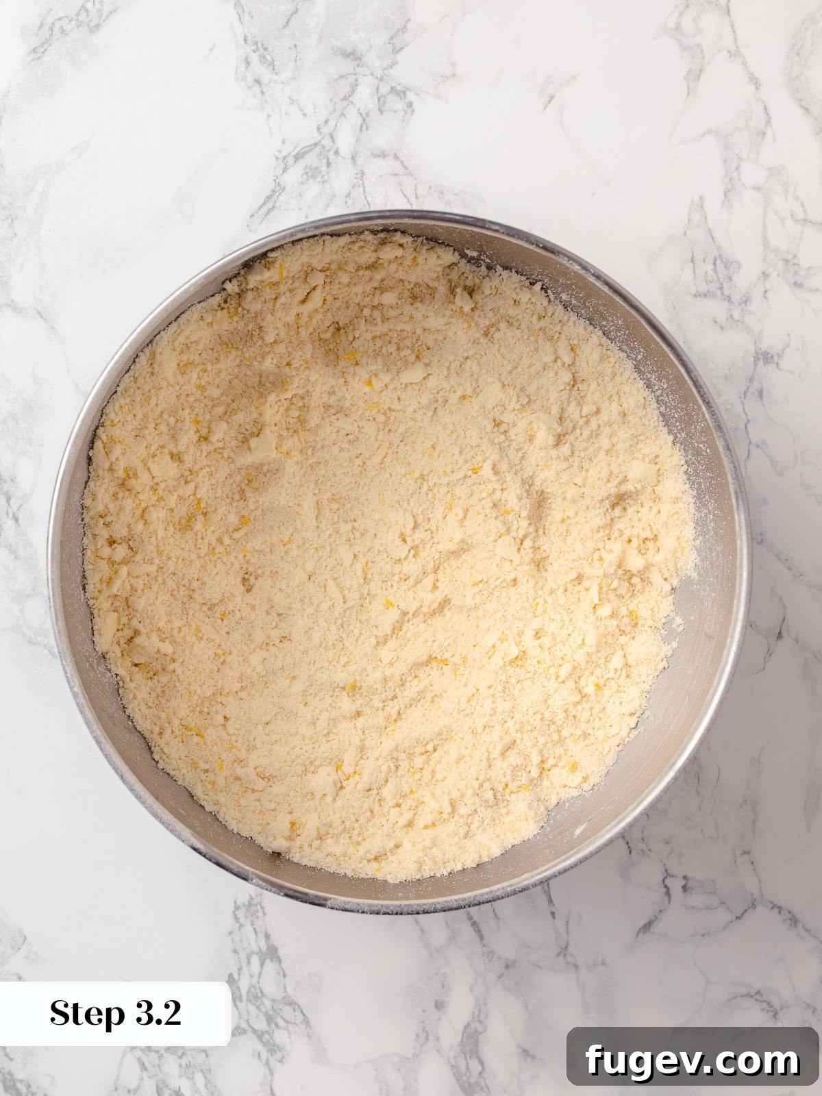 Sun-Kissed Lemon Scones 9 Flour and butter mixture after proper incorporation, resembling coarse, damp sand with no visible butter pieces.