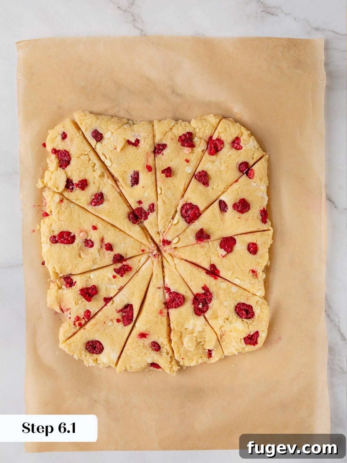 White Chocolate Raspberry Bliss Scones 15 The square of scone dough cut into triangles, ready to be separated for baking.
