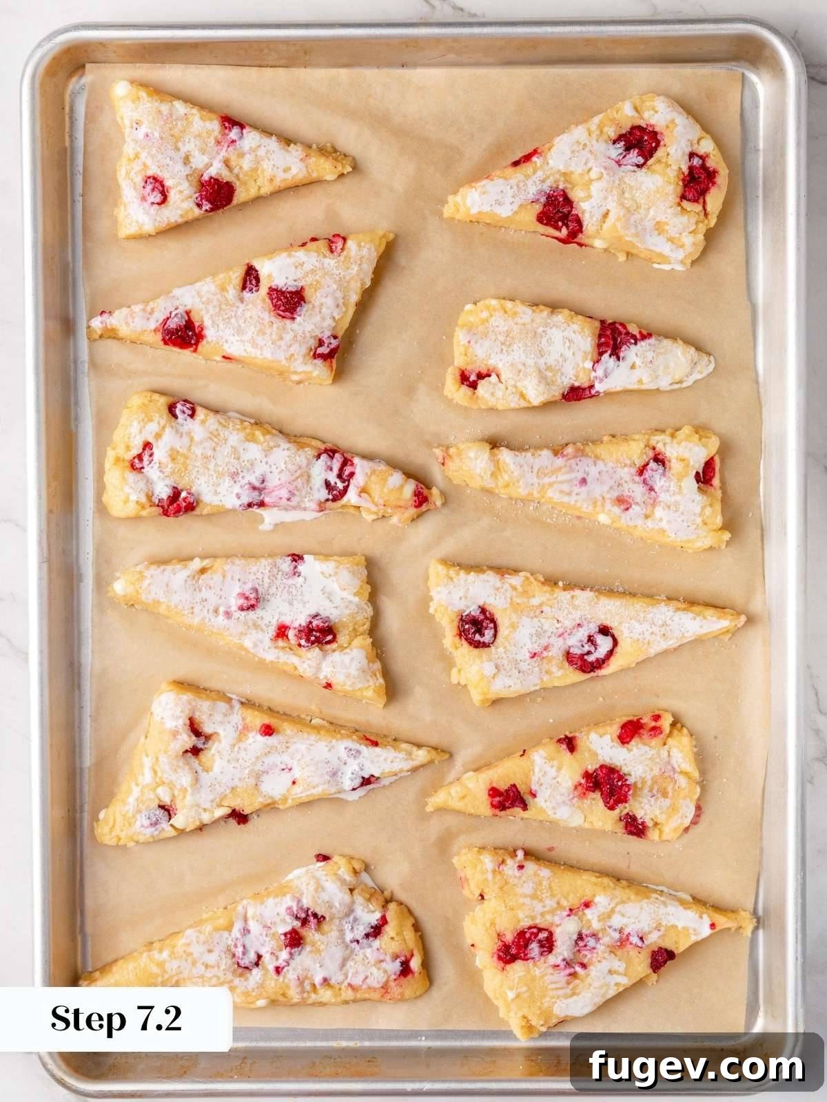 White Chocolate Raspberry Bliss Scones 18 The scones brushed with cream and generously sprinkled with sparkling sugar, ready for baking.