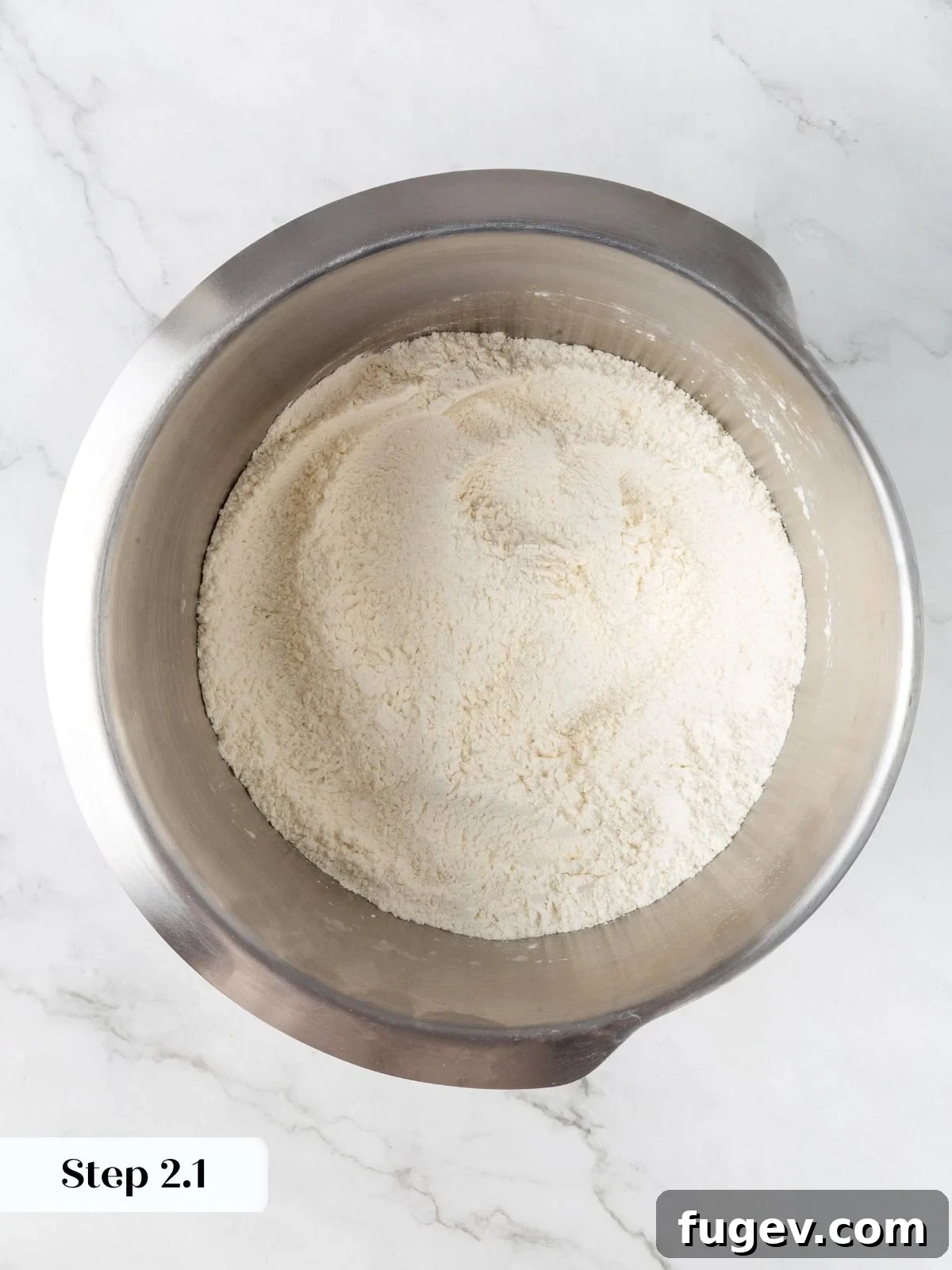 White Chocolate Raspberry Bliss Scones 6 Dry ingredients (flour, sugar, salt, baking powder) mixed in a stand mixer bowl.