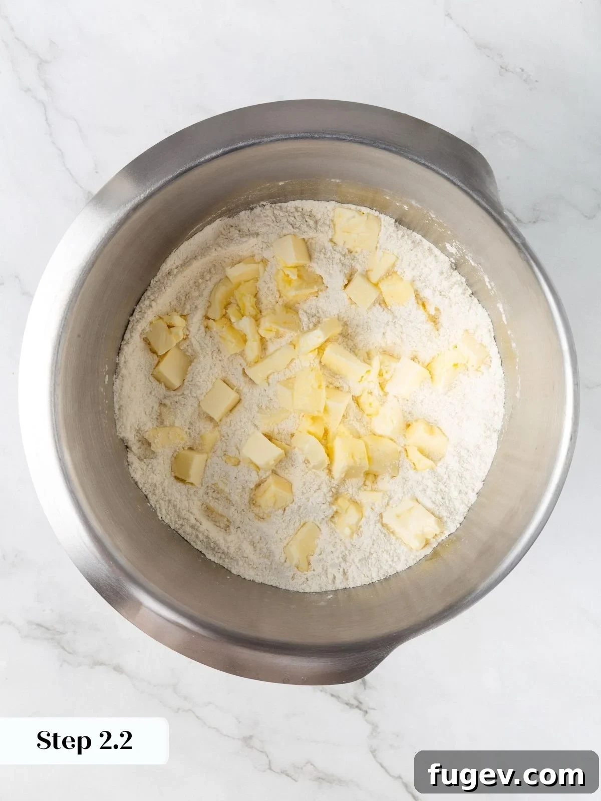 White Chocolate Raspberry Bliss Scones 7 Cold, cubed butter added to the dry ingredients in the mixer bowl.