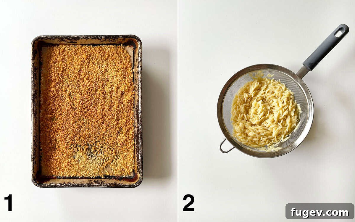 Toasted breadcrumbs on a sheet pan. Orzo in a mesh strainer.