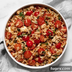 Caprese orzo pasta salad in a bowl.