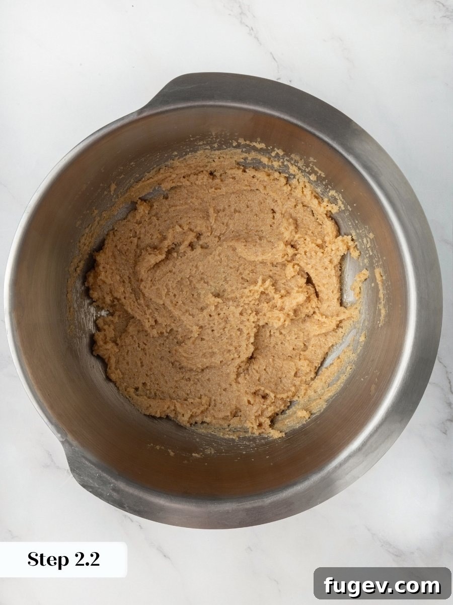 Creaming until light gives these almond flour chocolate chip cookies the structure to hold real height.