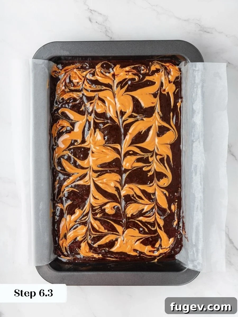 Fudgy Peanut Butter Brownies Recipe 12 The swirl shows distinct ribbons that keep peanut butter visible in every baked peanut butter brownie.