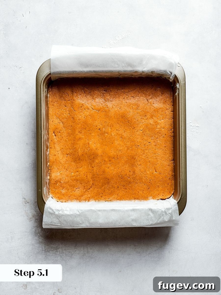 An even layer in the pan helps these peanut butter blondies bake to a uniform chew.