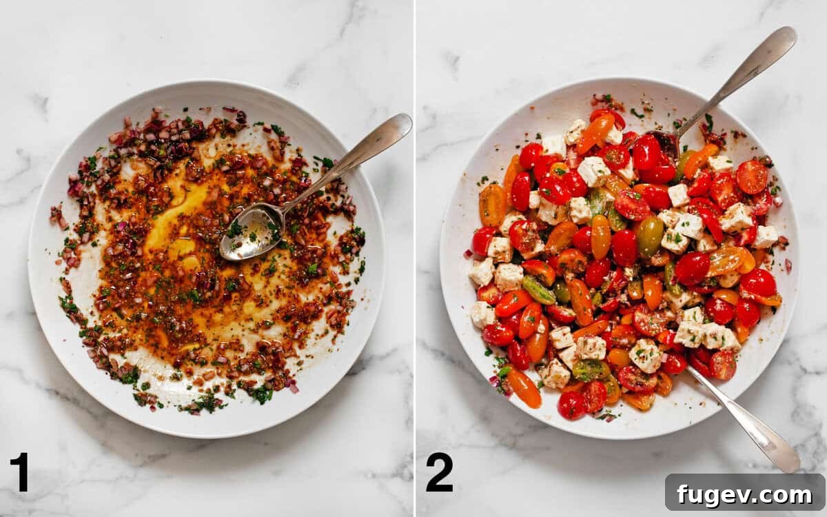Balsamic vinaigrette stirred in a large bowl. Tomatoes and feta stirred into dressing.