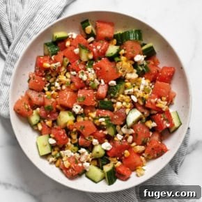 Watermelon cucumber corn salad in a bowl.