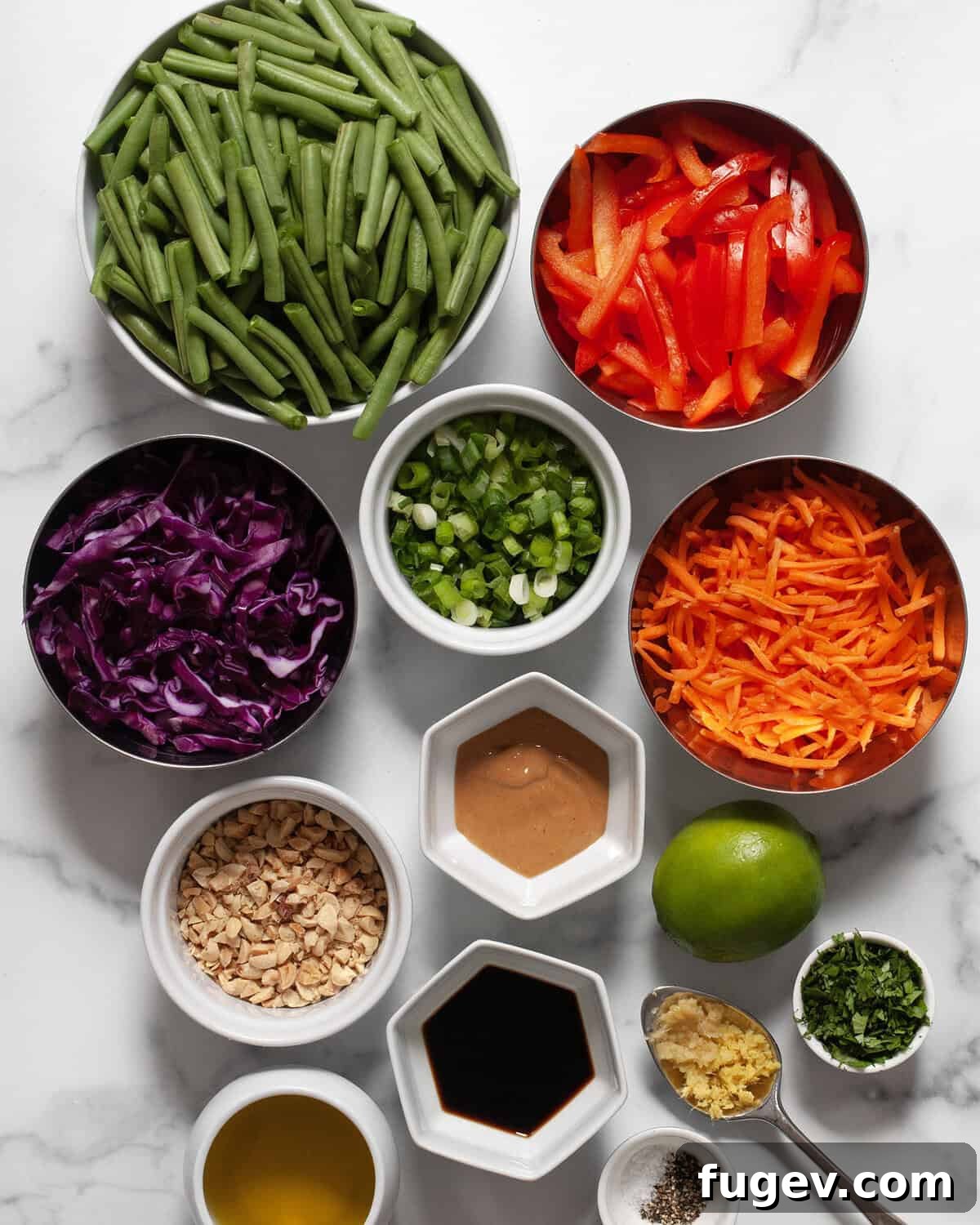 Crunchy Green Bean and Peanut Salad 3 Ingredients including green beans, shredded carrots, shredded cabbage, bell peppers, scallions, cilantro, ginger, garlic, peanut butter, lime, salt, pepper and oil.