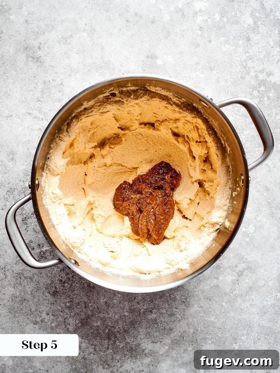 Beating the paste through the dough spreads moisture and molasses depth into every oatmeal cream pie.