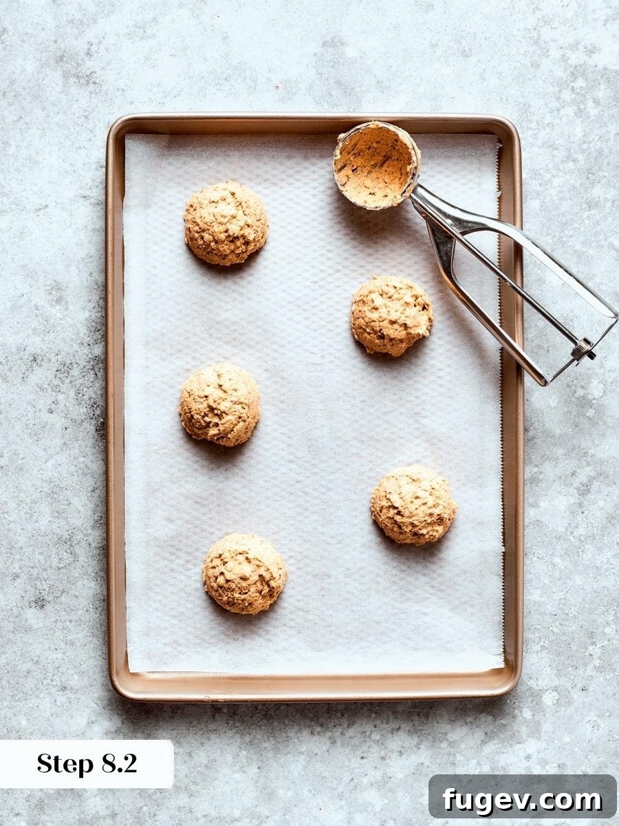Portioning at an even size ensures each oatmeal cream pie cookie bakes and spreads exactly alike.