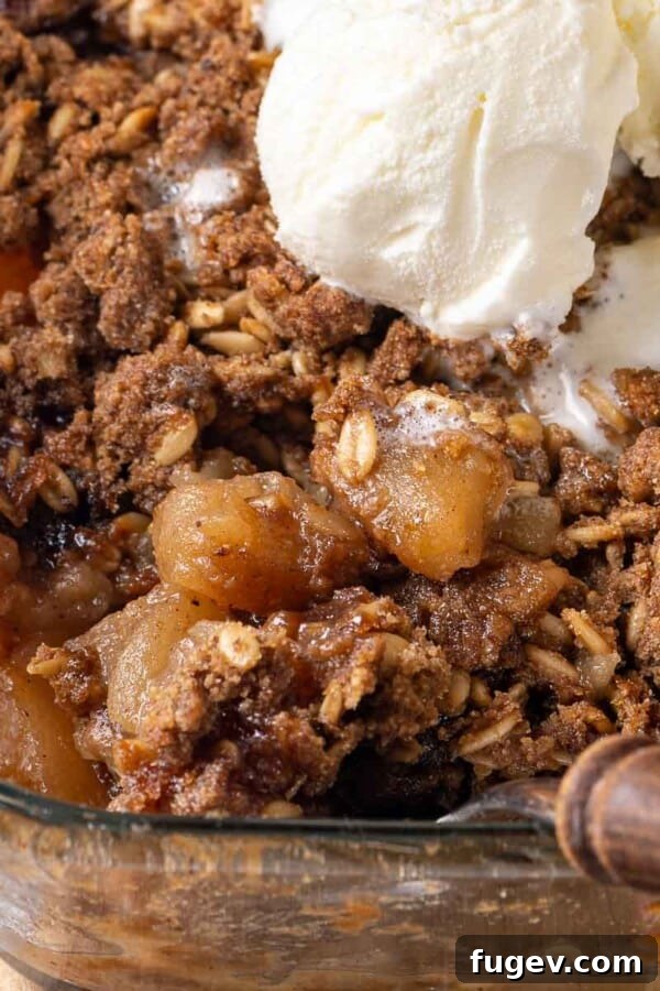 Classic French Apple Cake Recipe 12 baked apple crisp being dished.